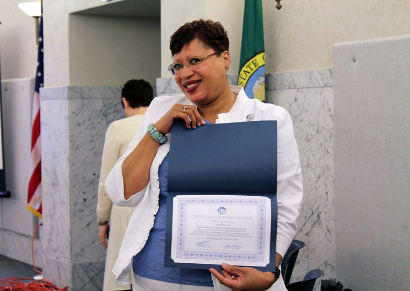 woman holding certificate of participation