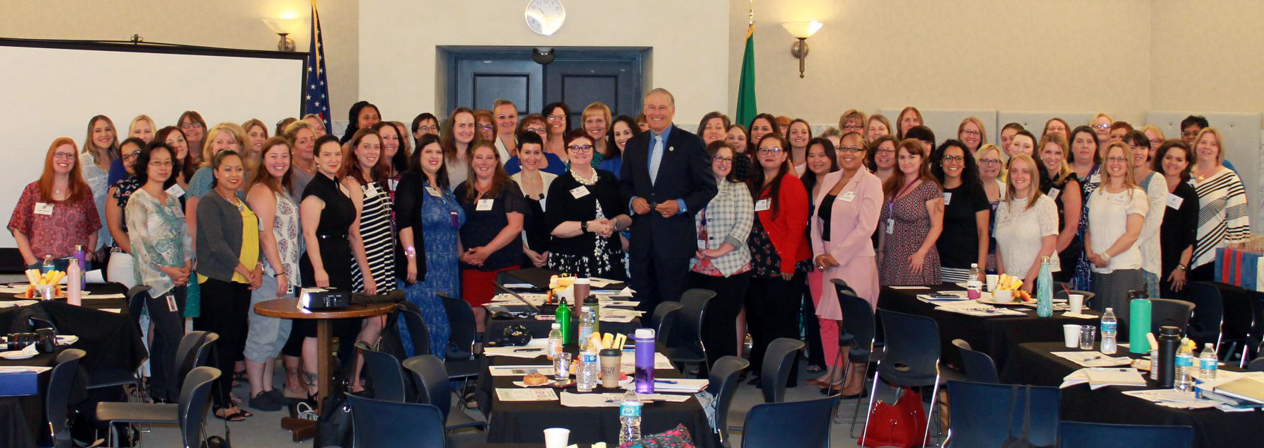 Governor Jay Inslee (center) poses with ICSEW representatives at the 2018 Transition Celebration in Olympia.