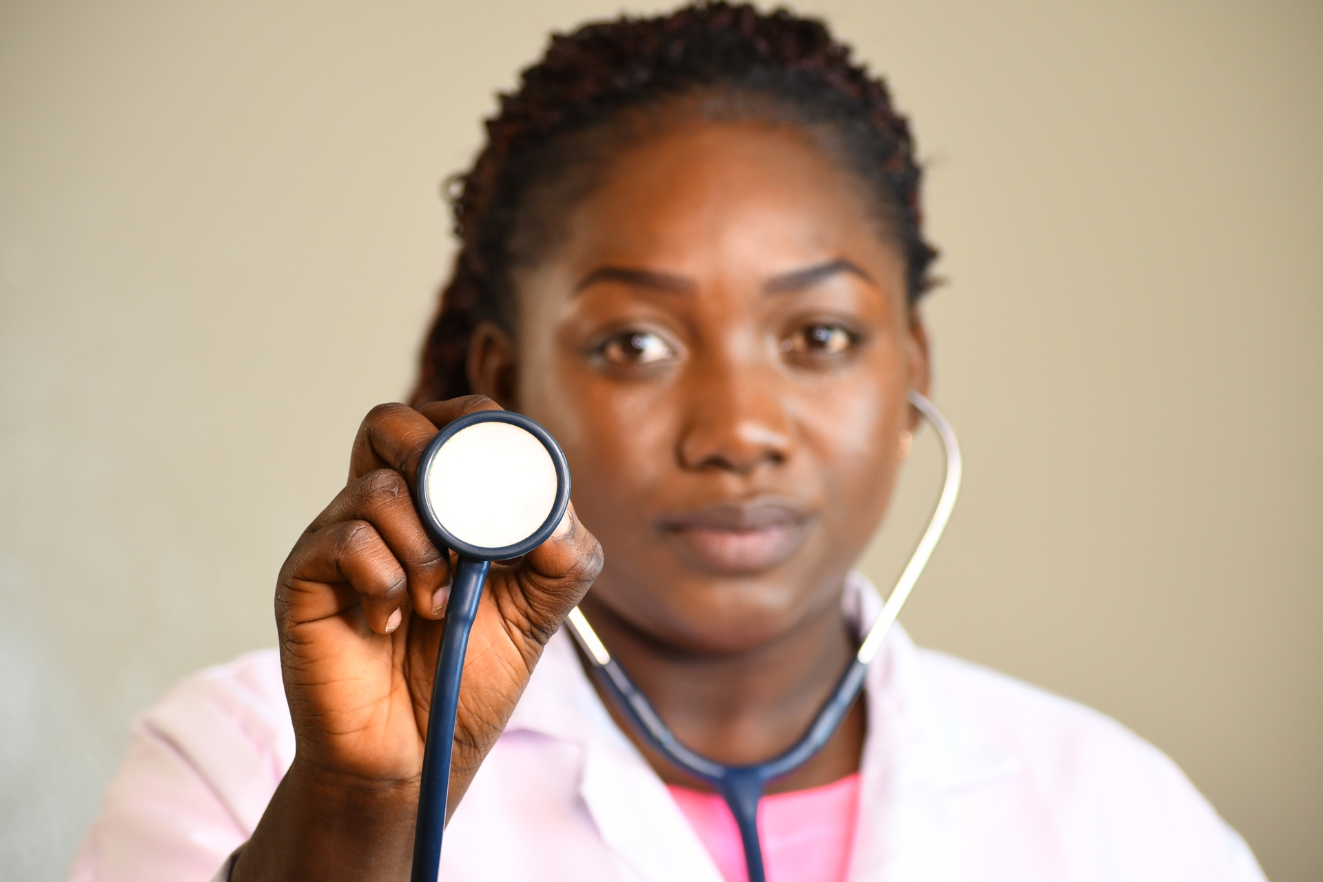 image of black doctor holding a stethoscope